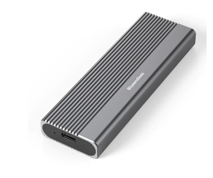 Grey ribbed aluminium M.2 SSD enclosure shown at an angle, with its USB-C port visible on the end