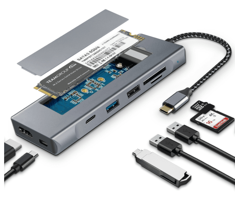 Silver-grey aluminium 8-in-1 USB-C hub with its M.2 bay open and a demonstration SSD fitted, showing the HDMI, USB-C, USB-A and card-slot ports