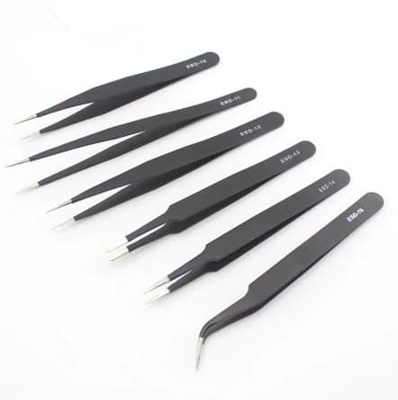 Six precision tweezers laid out on a white background showing straight fine-point, tapered, flat and curved tip profiles, each marked ESD-10 to ESD-15